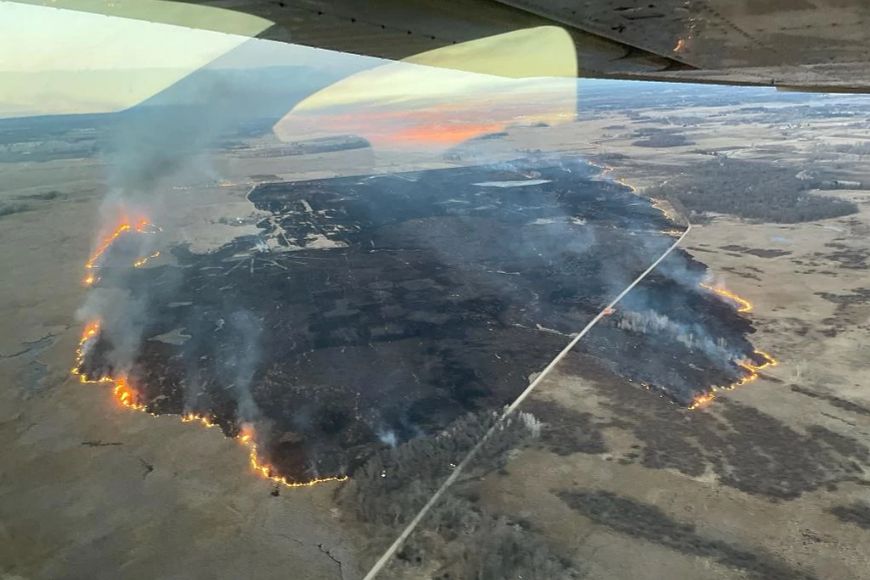 aerial of 750 acre fire burning in the white river marsh state wildlife area